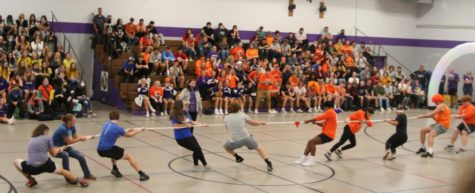 Facing off, representatives from the senior and sophomore classes begin Tug of War. 