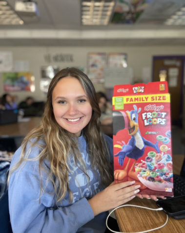 Senior Kara Bell gets creative, using a cereal box in place of a backpack. 